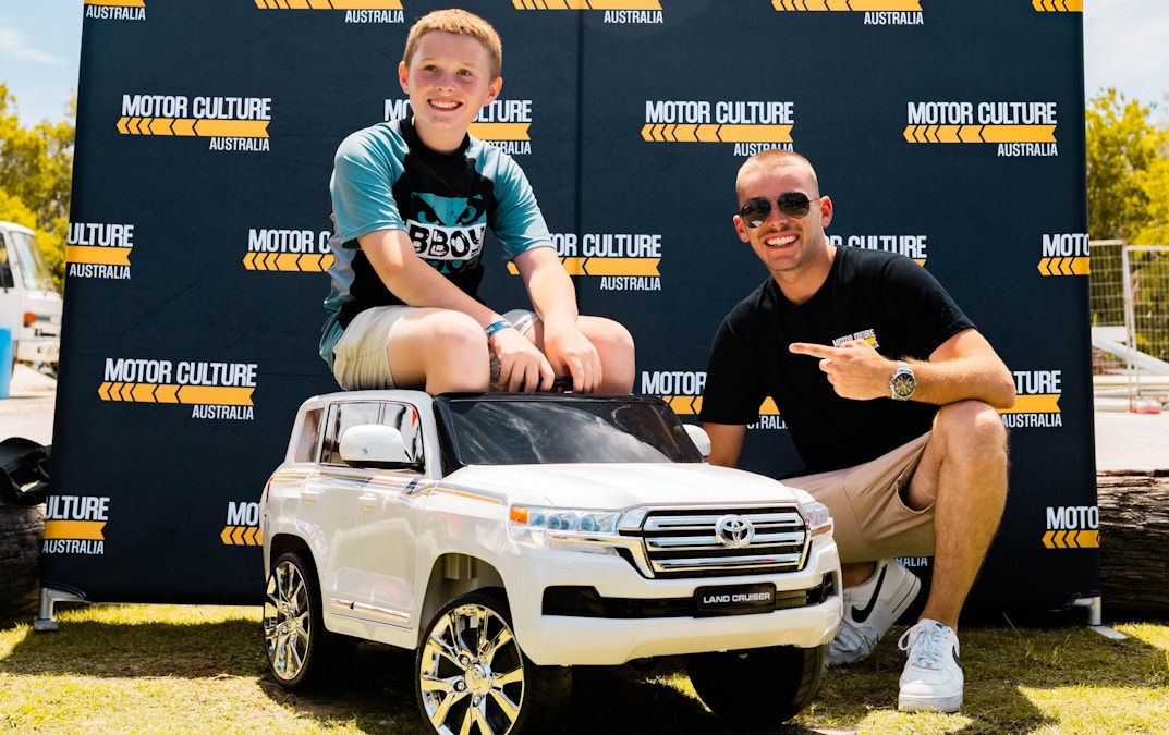 Thousands motor to car show